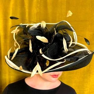 Beautiful black and white sunhat with feather details ready for Derby!